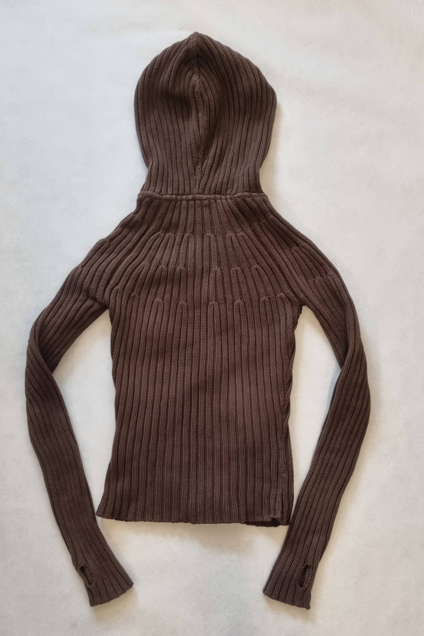 Brown ribbed knit hoodie with double zipper on a light beige background
