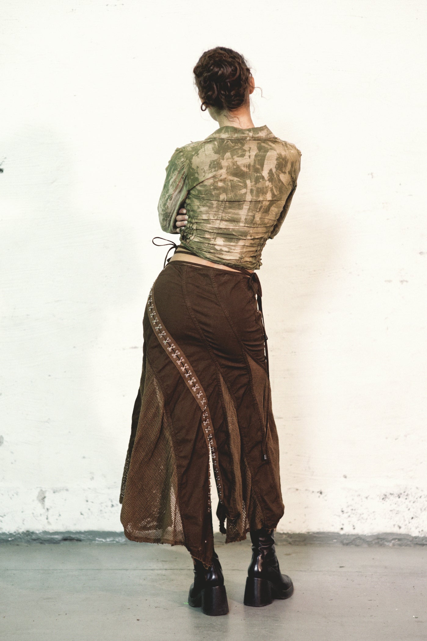 model wearing from back Double Collar Voile Shirt Hand Dyed Silk Cotton with Long Sleeves & Shirred Waist & hook and eye